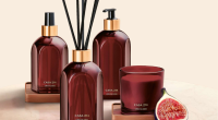 vela perfumada, difusor e home spray da linha Figo Magnífico sobre mesa sofisticada com decoração aconchegante
