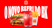 Lata de Coca-Cola ao lado de hambúrguer e batata frita em divulgação