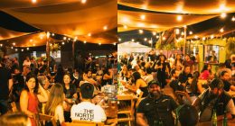 Área externa do Dragons Beer recebe clientes durante evento com música ao vivo e cerveja artesanal.