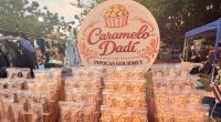 Dádiva Pavão, criadora da Caramelo Dadí Pipocas Gourmet, durante feira em Campo Grande.